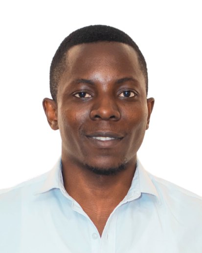 Dr. Ehoneah Obed smiling, in a light blue shirt, against a plain white background